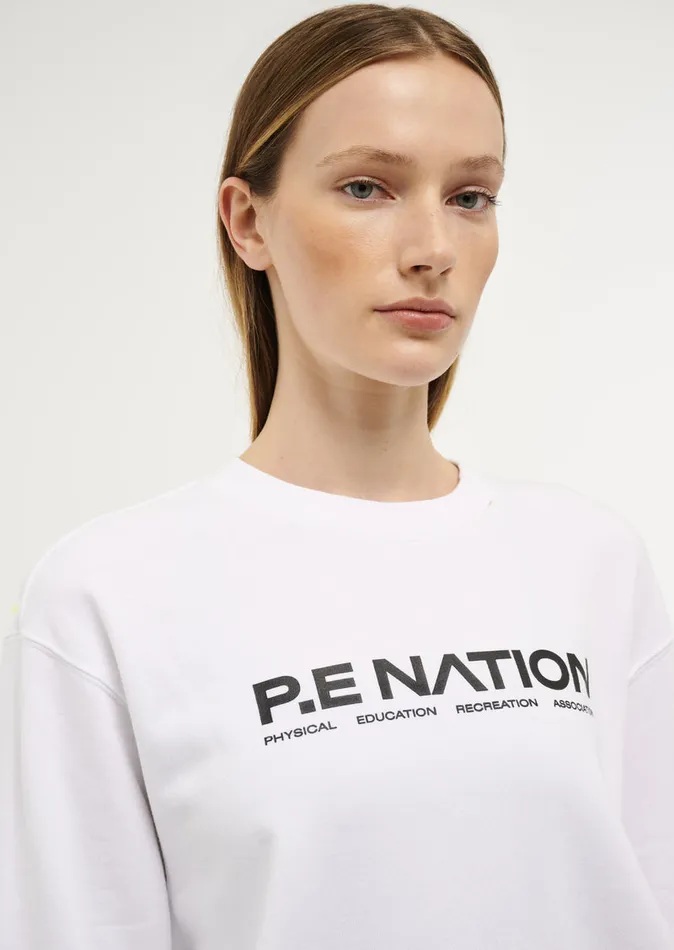 Baseline QUALIFY SWEAT IN OPTIC WHITE PE Nation Women
