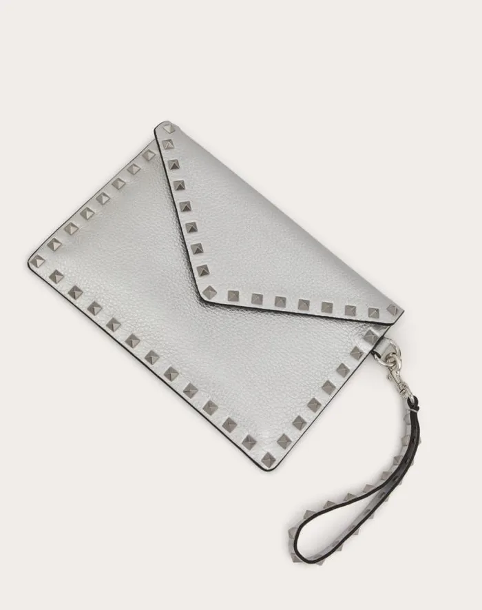 Valentino Mini Bags Woman Rockstud Metallic Grainy Calfskin Clutch Bag For Woman In Silver Silver